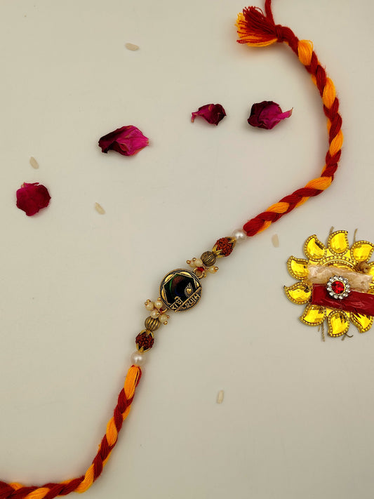 Golden Charm Rakhi with Braided Thread