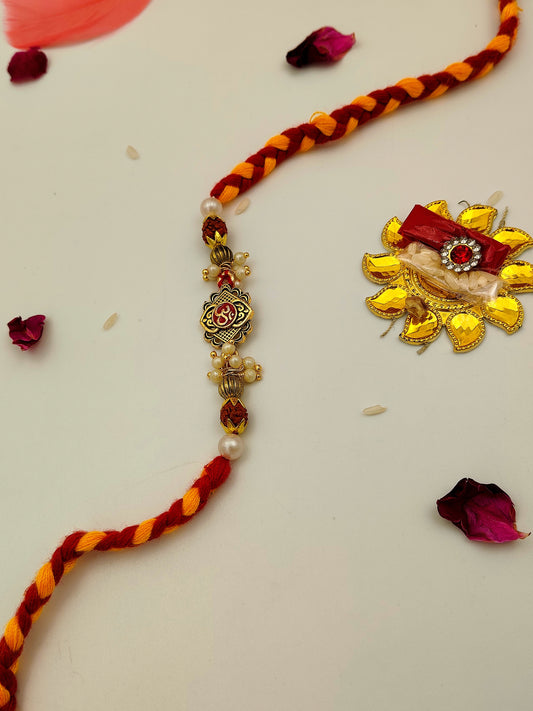 Golden Charm Rakhi with Braided Thread